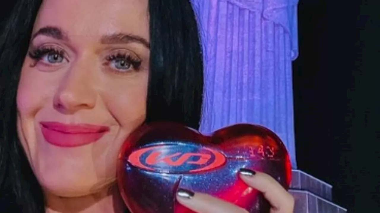 Katy Perry showcases her pert derriere in tiny bikini - after critics savaged her 143 album