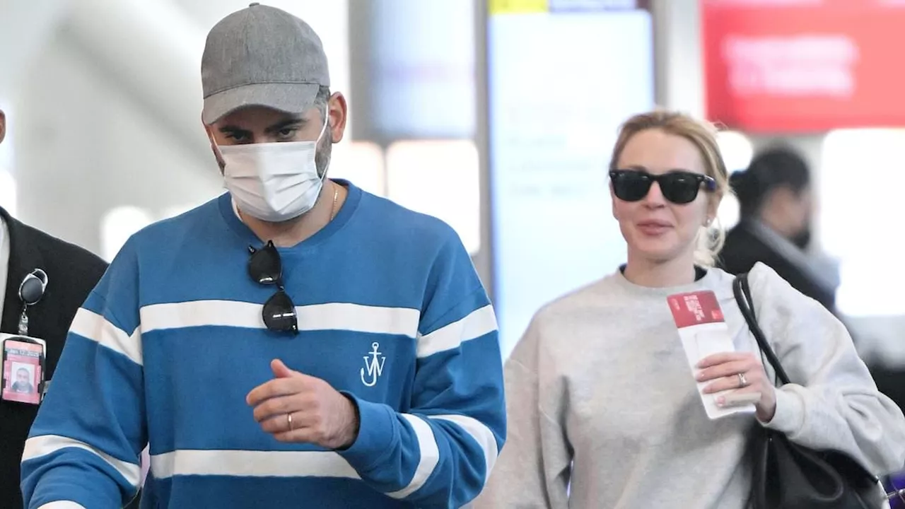 Lindsay Lohan and husband Bader Shammas arrive to NY airport with son Luai... after she wrapped...