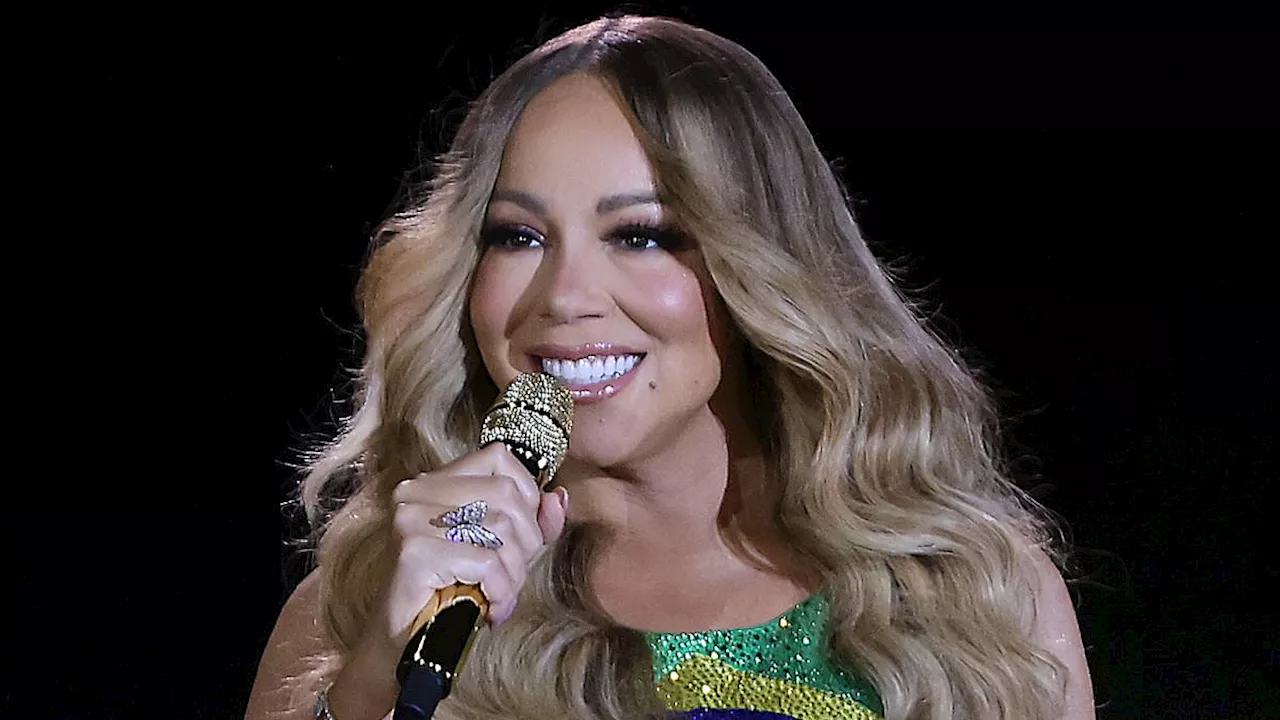 Mariah Carey sparkles in a bedazzled Brazilian flag dress during Rock in Rio Festival...