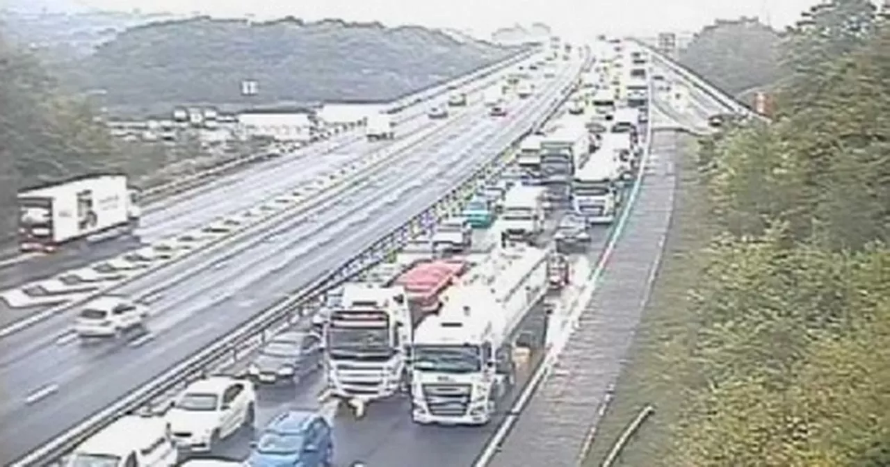 Two people taken to hospital after becoming trapped in cars after M56 crash