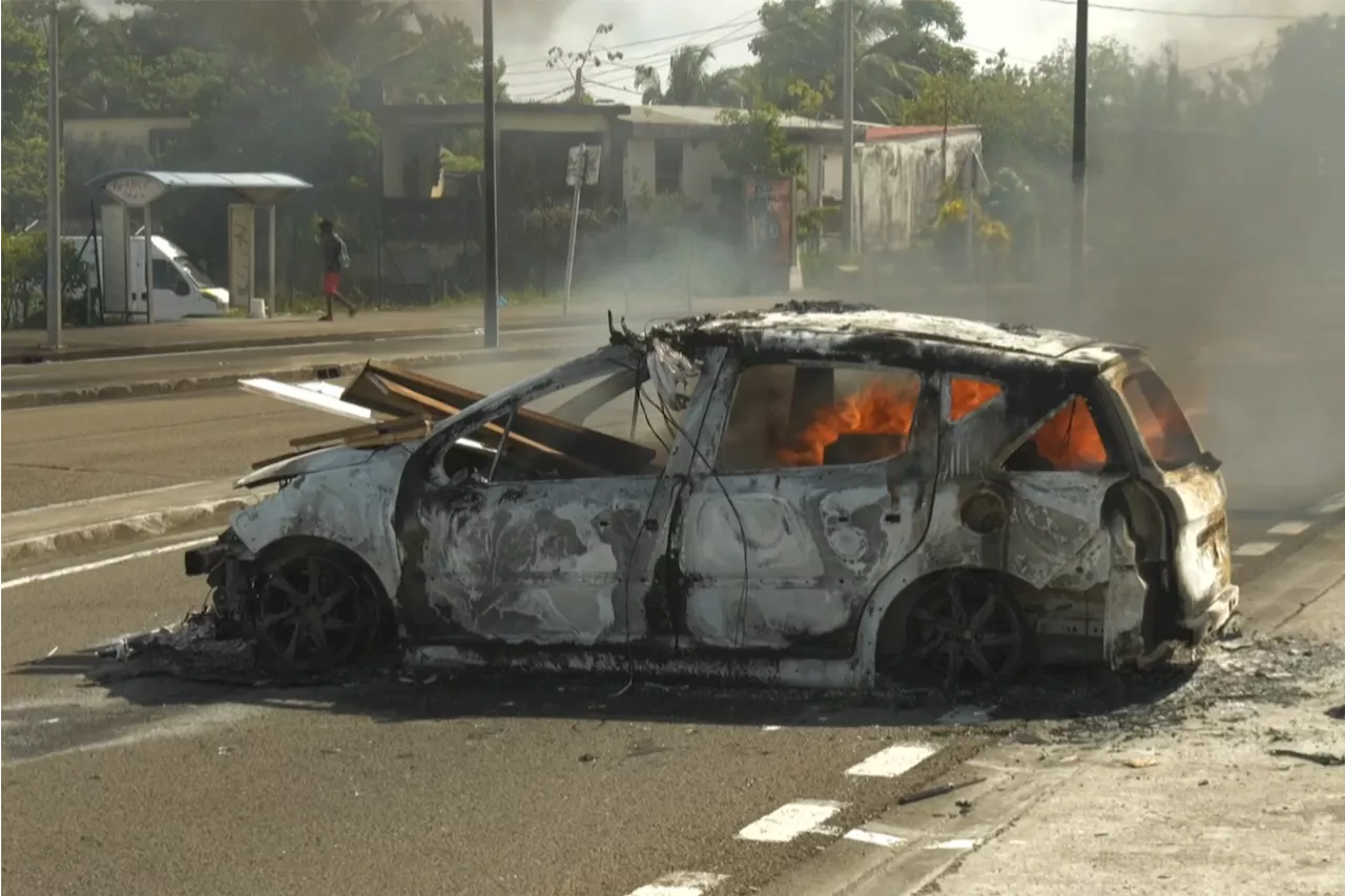 French anti-riot forces sent to Caribbean territory as thousands defy bans on protests