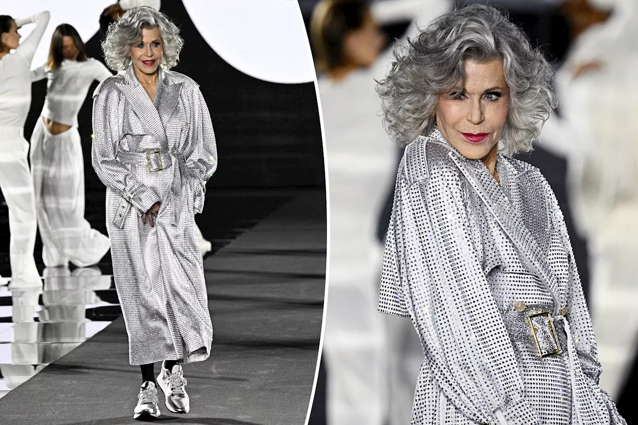 Jane Fonda struts her stuff for L'Oréal Paris runway in sparkling trench coat and sneakers