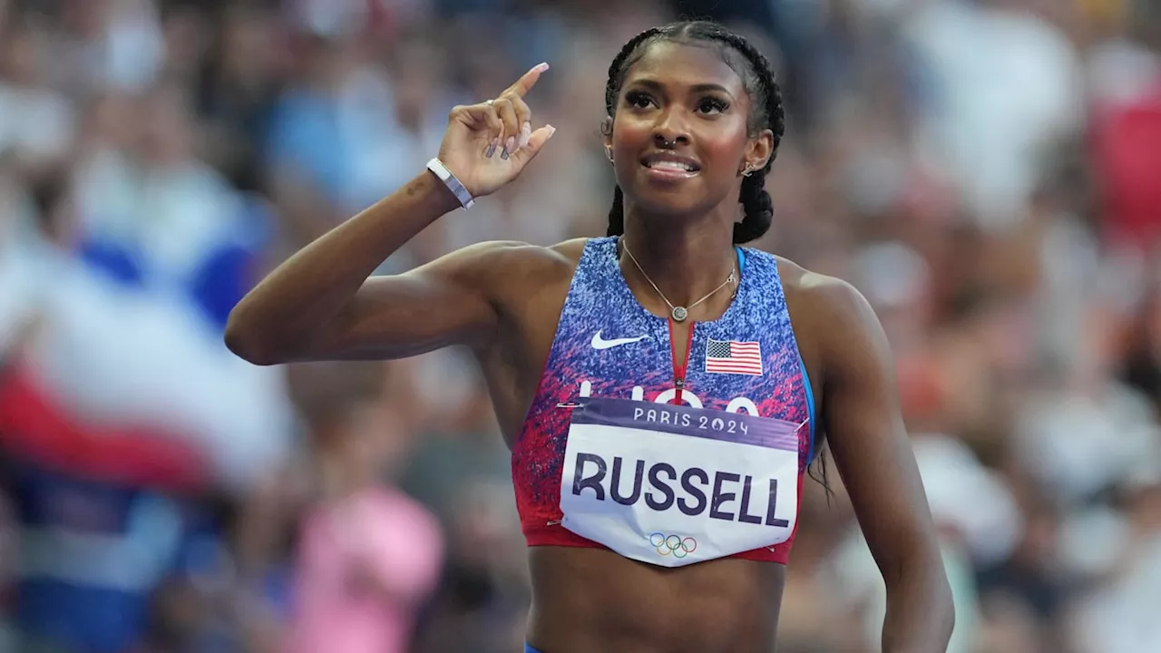 Olympic champ Masai Russell flexes gold medal with Rolls Royce, matching fit