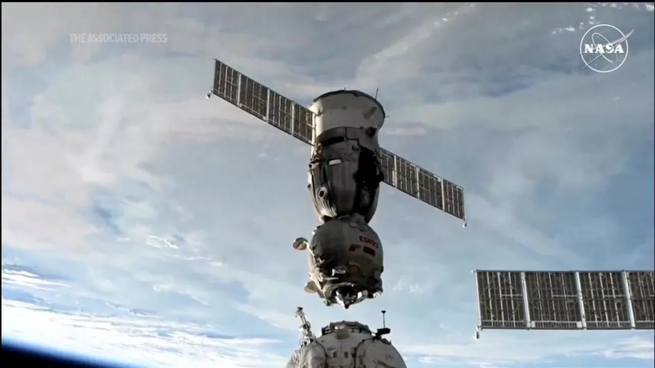 Soyuz space capsule bringing 3 Space Station crew members back to Earth