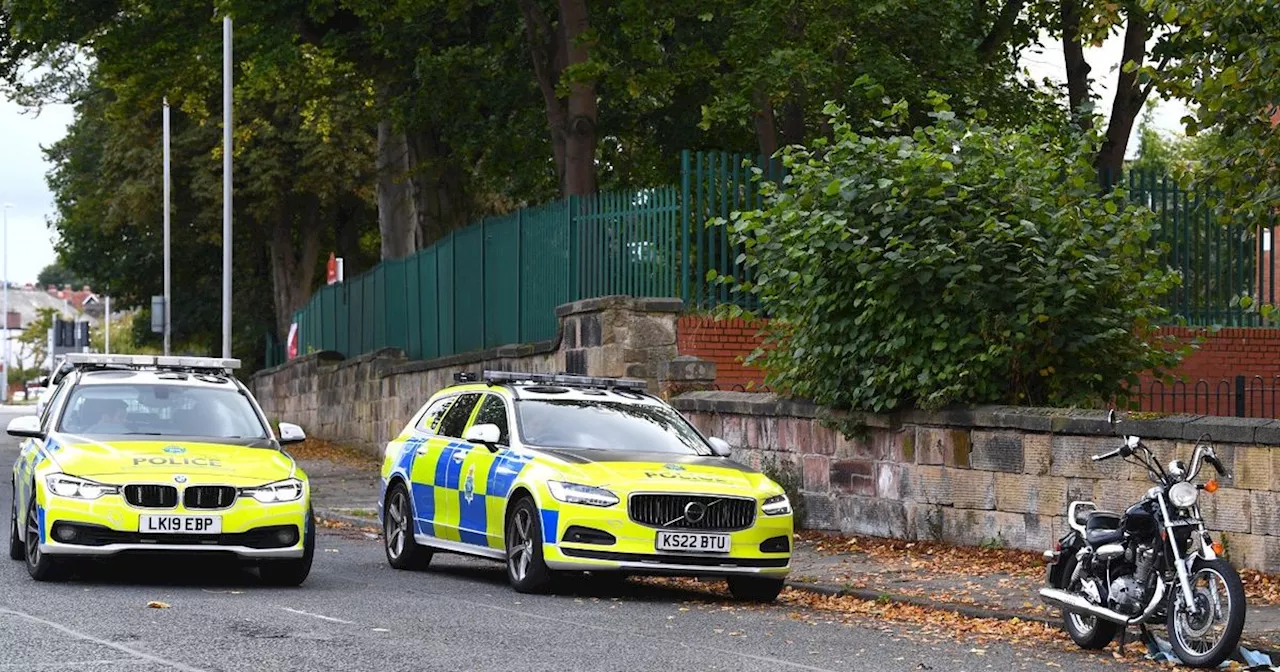 Police close road outside primary school after motorbike crash