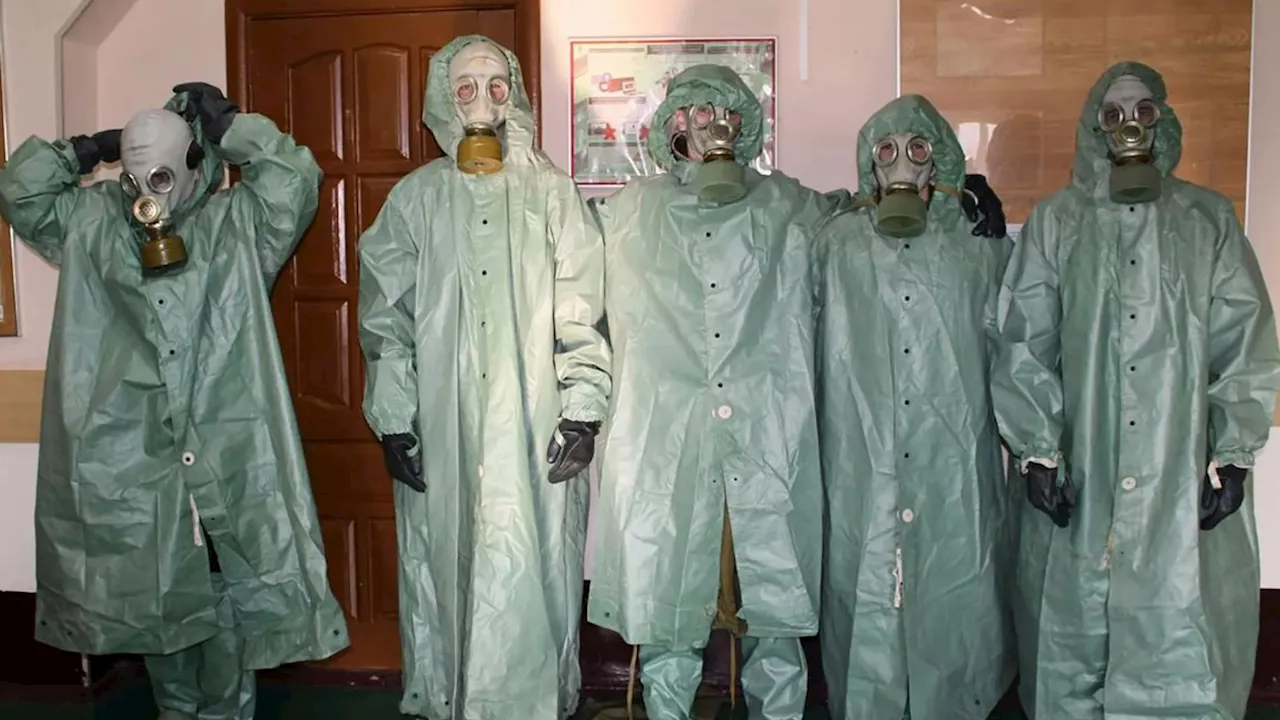 Chilling moment Russian schoolchildren dress in haunting hazmat gear as Putin grooms kids to fear Western...