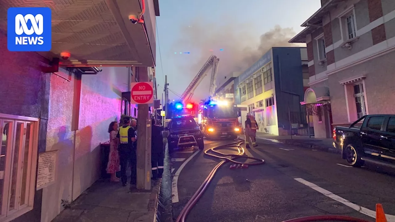 Investigators remain at scene of fire that engulfed wedding venue in Brisbane's Woolloongabba