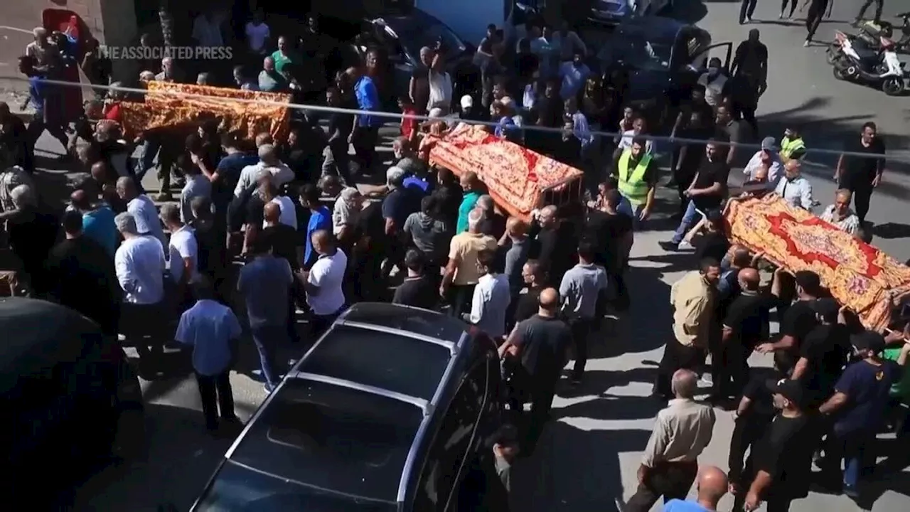 Lebanese village holds funerals for 11 dead in Israeli strikes, including women and children