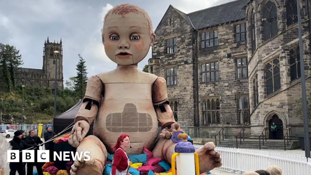 Rochdale 'freaked out' by arrival of giant baby puppet