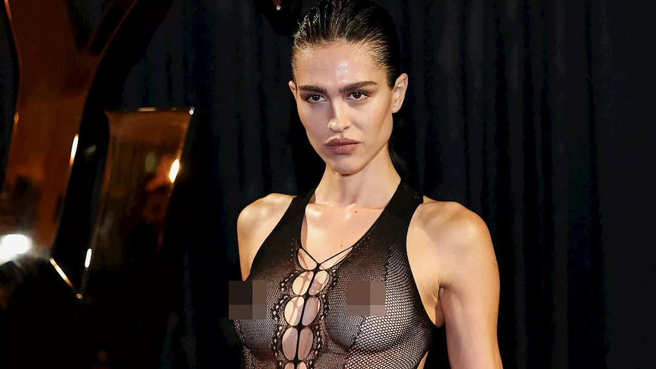 Amelia Gray Hamlin goes BRALESS in sheer top during Saint Laurent show at Paris Fashion Week