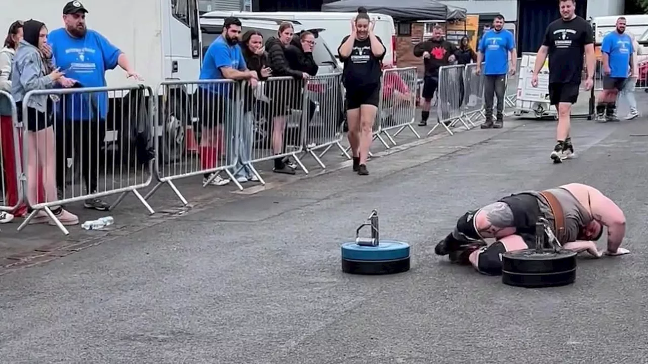 Shocking moment Strongman collapses as kneecaps shoot up into thighs