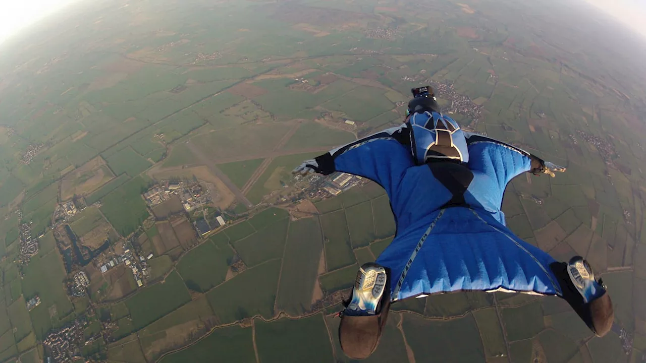 Wingsuit Flyer Makes Astonishing Jump From Helicopter Into Artificial Wave