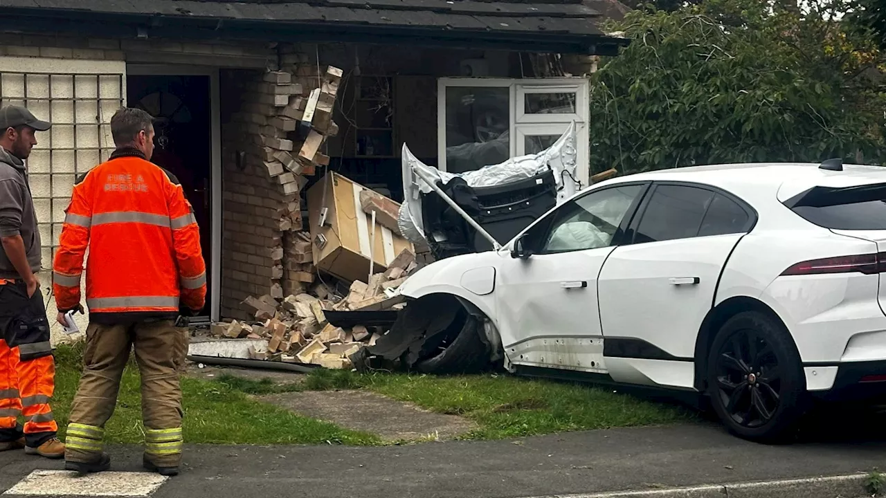 Homeowner makes ‘lucky escape’ as £73,000 Jaguar smashes through the front of their bungalow after ‘par...