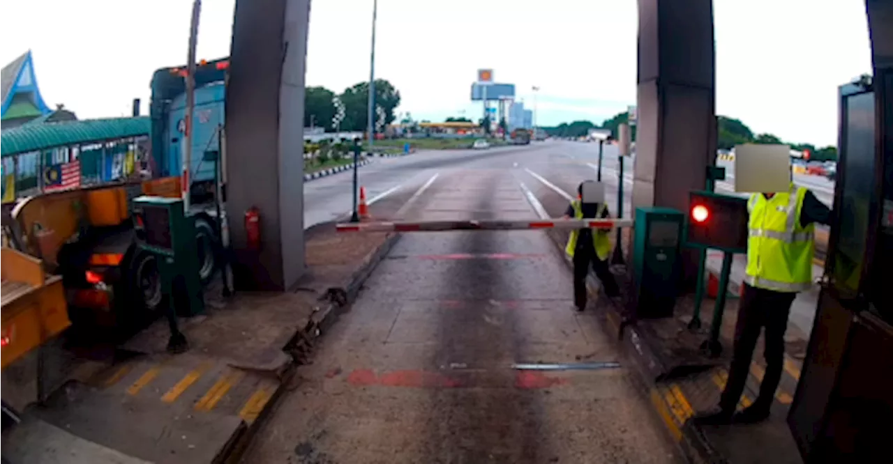 Motorcyclists duck under boom gate, cause it to hang