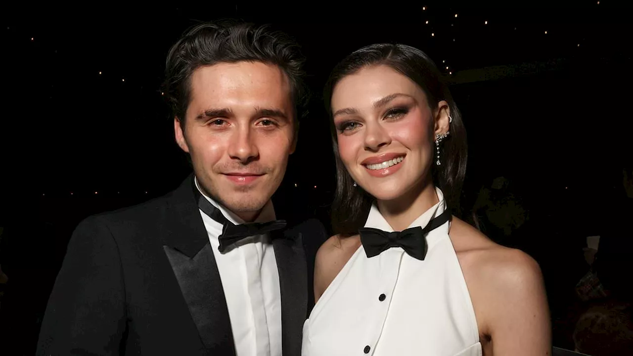 Brooklyn Beckham and Nicola Peltz Twin in Tuxes Supporting Victoria at Paris Fashion Week