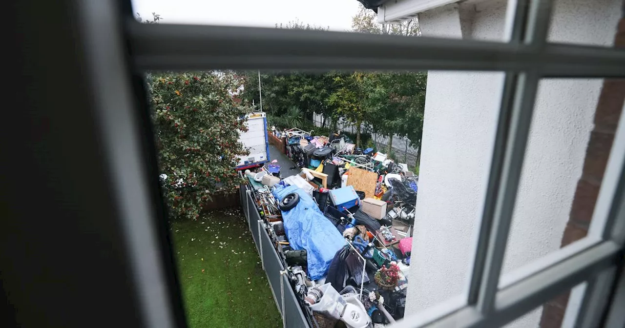 Rubbish heap towers over fence as mum says she's at her wit's end