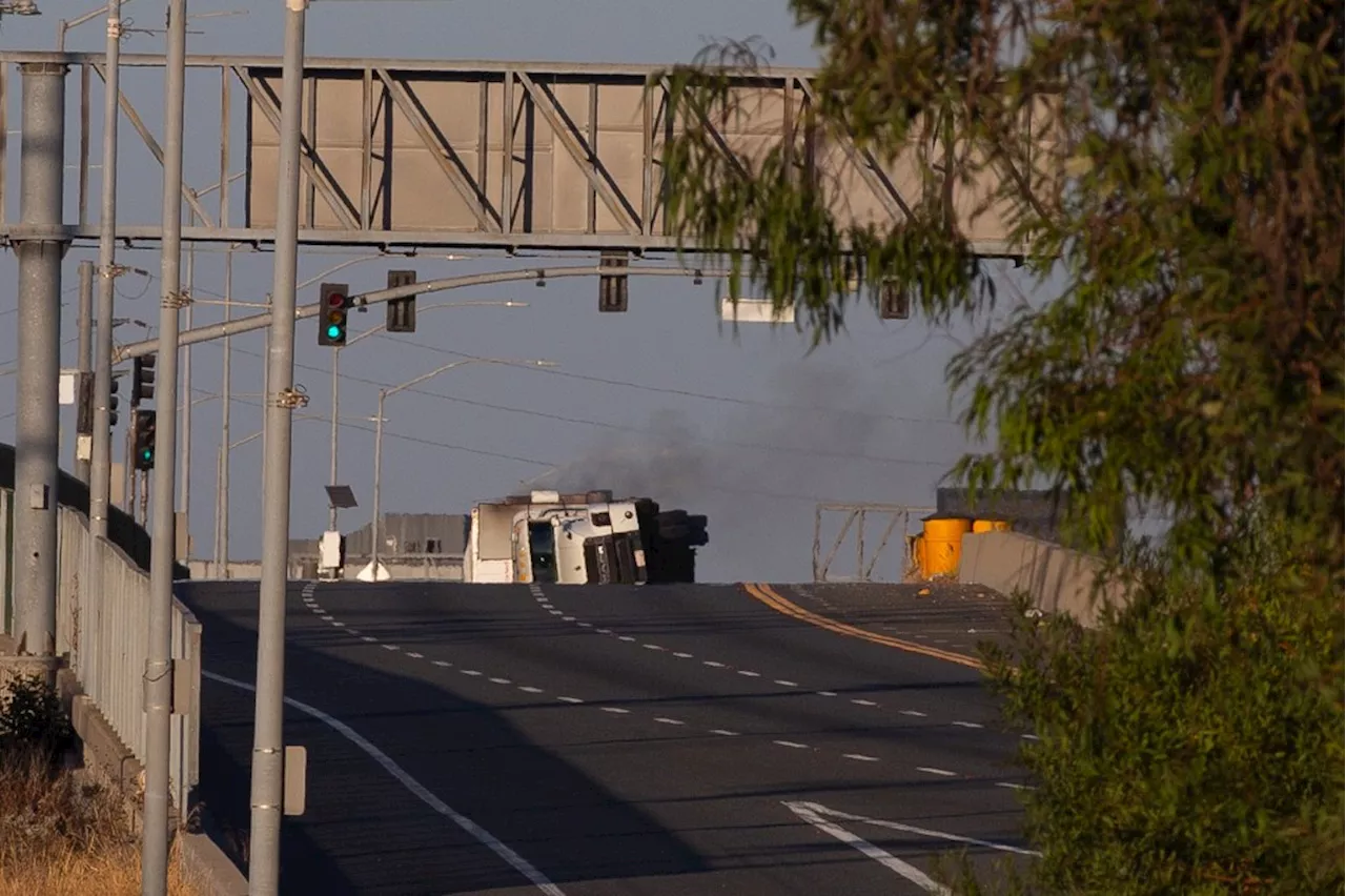 Overturned truck spills lithium-ion batteries on California freeway, sparks fire