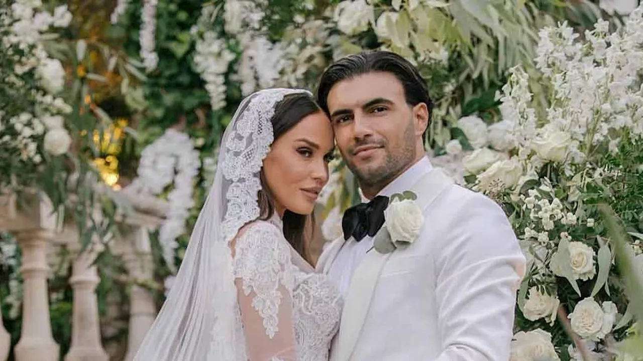 Vicky Pattison stuns in an incredible full lace bridal gown and a dramatic veil as she shares first...