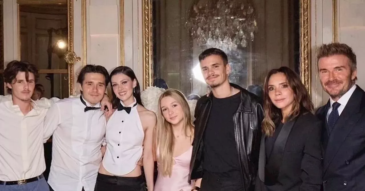 Victoria Beckham supported by David and their kids at Paris Fashion Week show