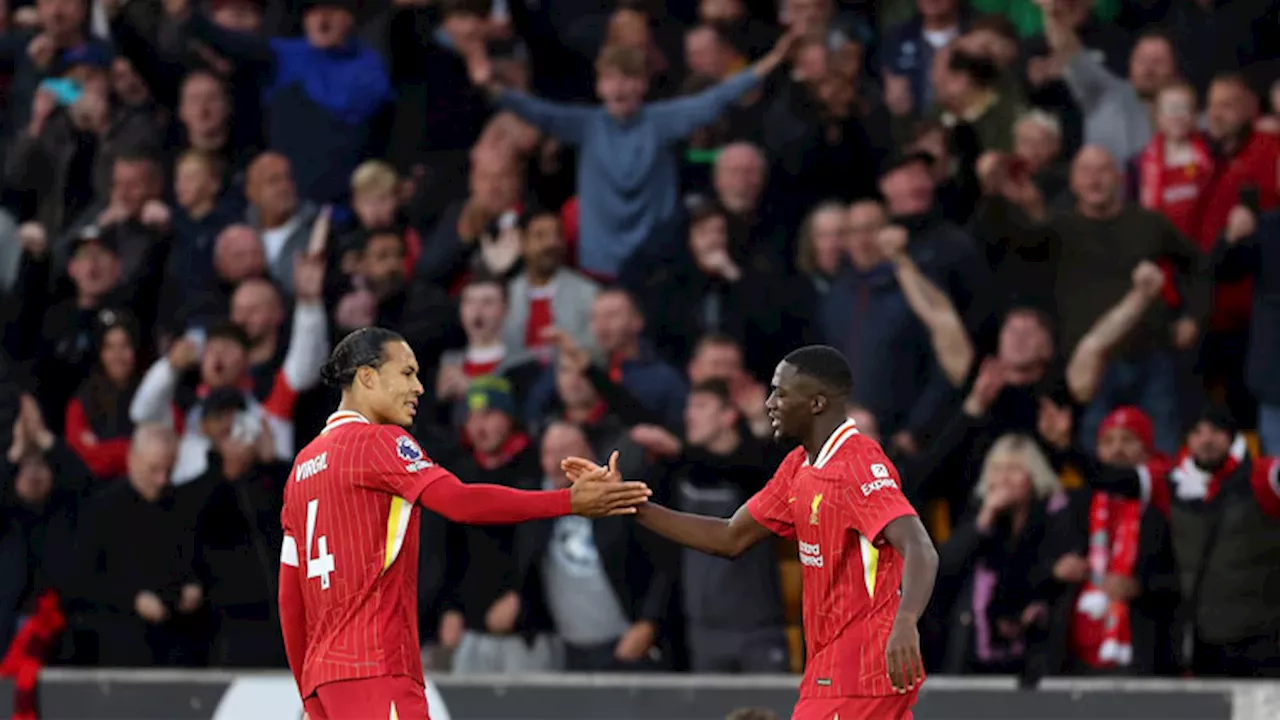 Liverpool go top of Premier League with 2-1 win over hapless Wolves