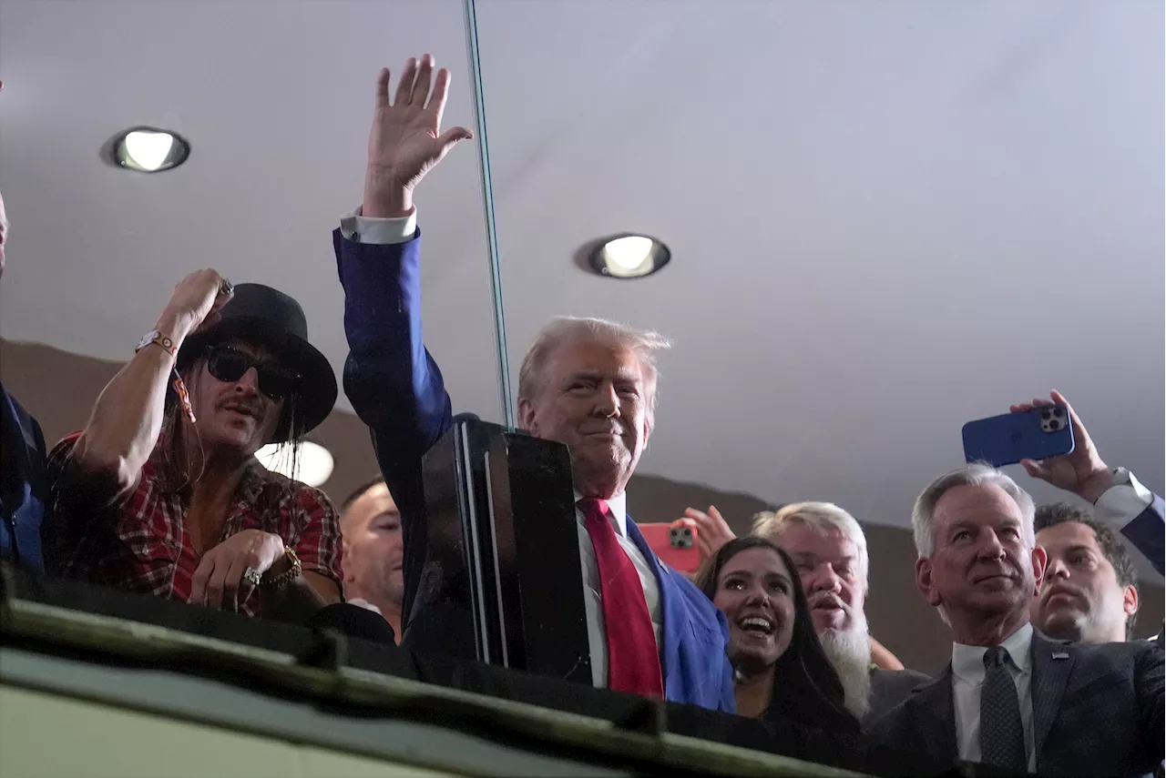 In Alabama, Trump goes from the dark rhetoric of his campaign to adulation of college football fans