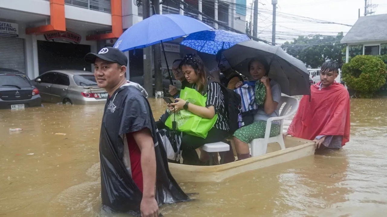 Fierce storm blows out of northern Philippines after leaving 14 dead in landslides and floods