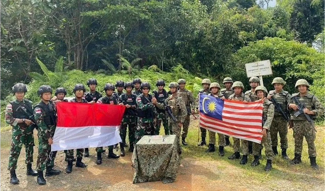 Indonesian, Malaysian troops celebrate unity at border in honour of Malaysia's National Day