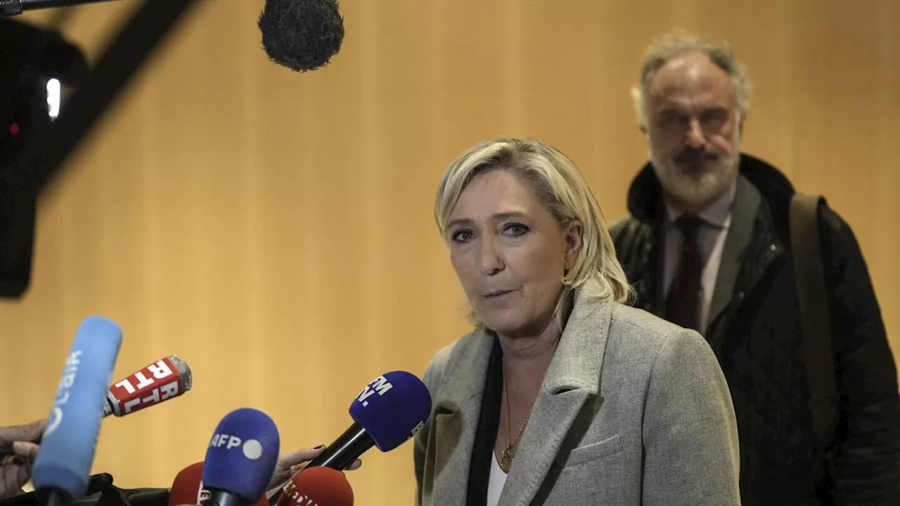 France's Le Pen denies wrongdoing as she and her party go on trial accused of embezzling EU funds