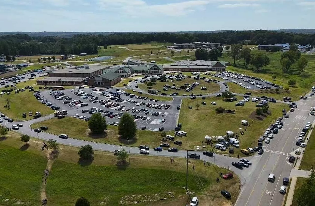Shooter kills 4 at a Georgia high school and a 14-year-old student is in custody, officials say