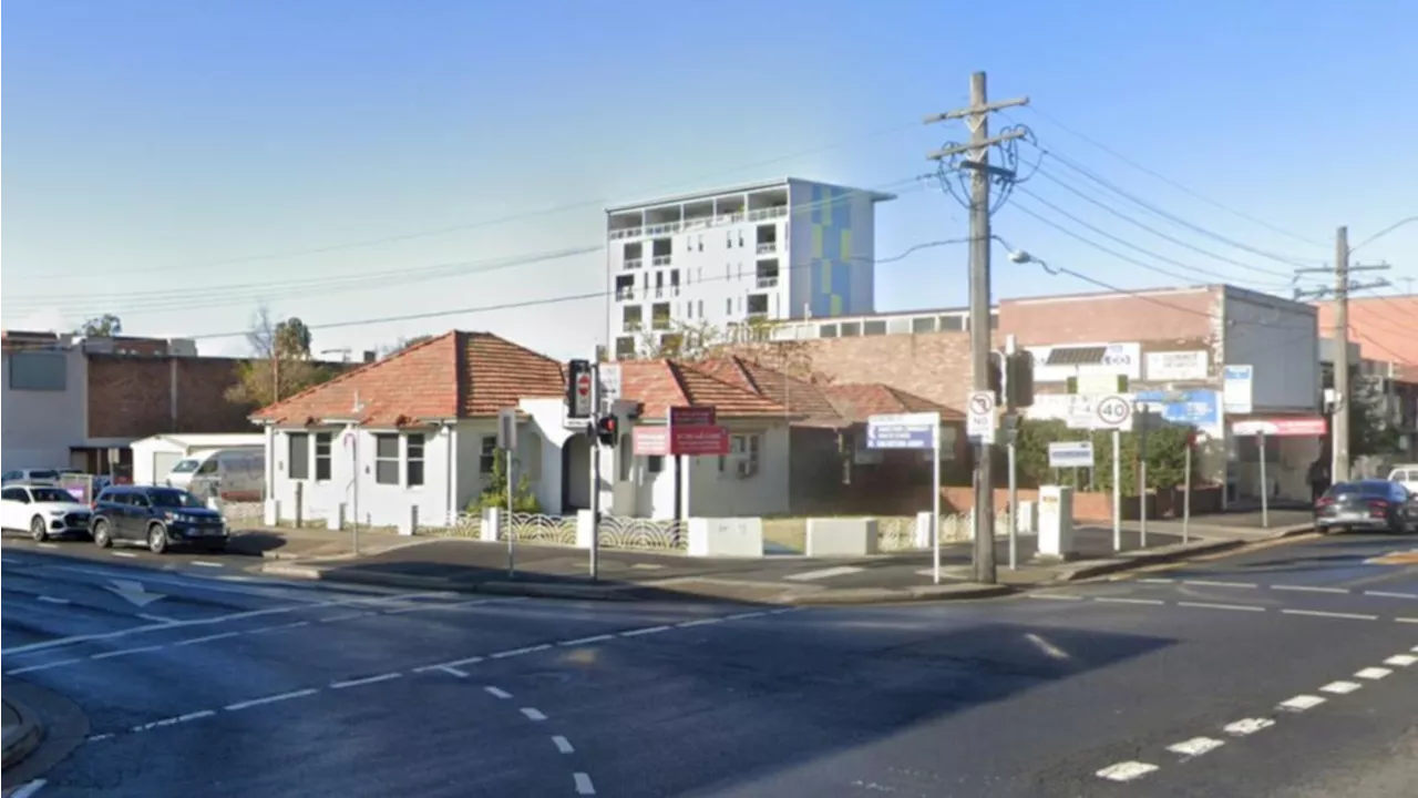 Down power pole and wires trap two people in car as Tesla crashes at Bankstown, in Sydney’s southwest