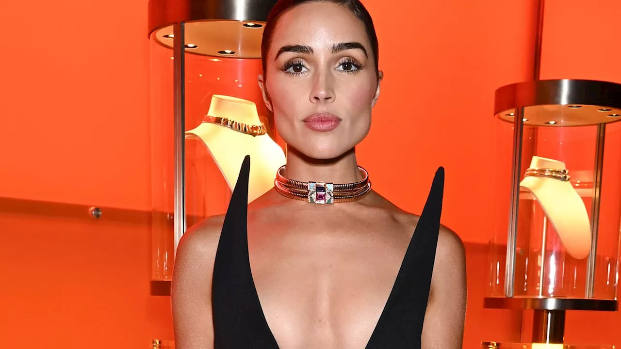 Olivia Culpo puts on busty display in plunging black dress at Bulgari party during NYFW