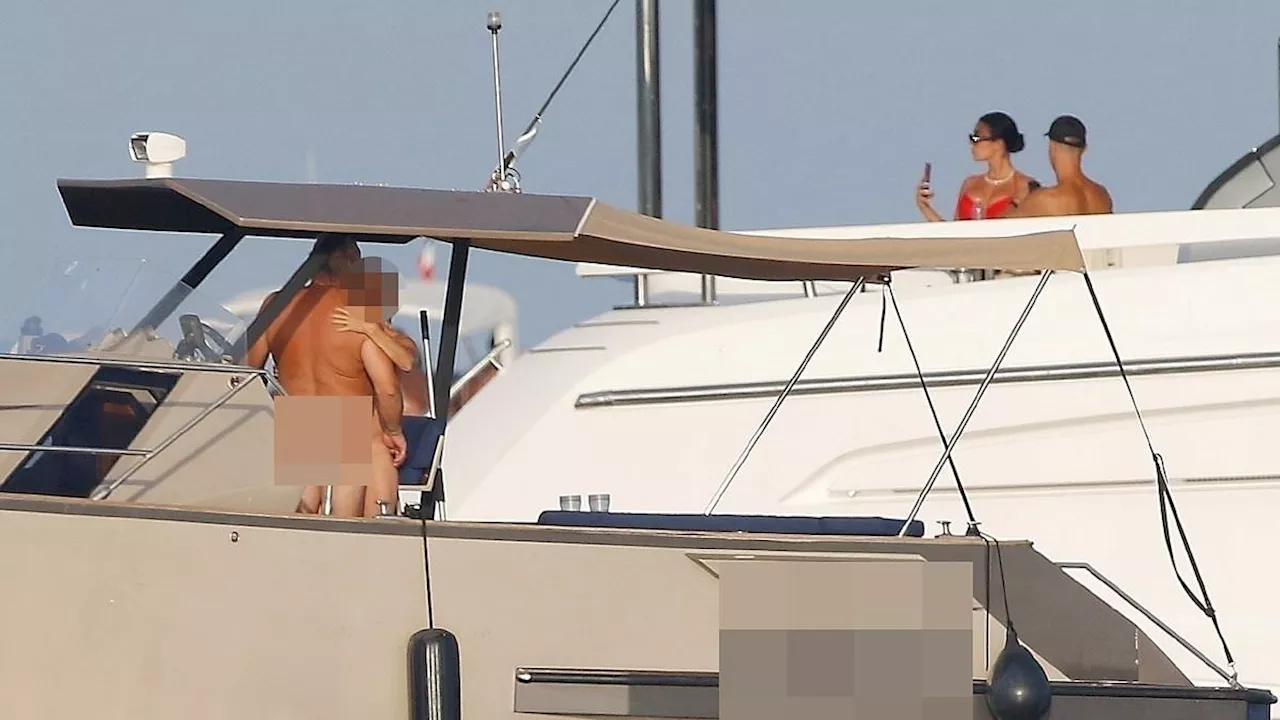 What's happening below deck? Cristiano Ronaldo appears to miss the REAL action as naked couple sail...