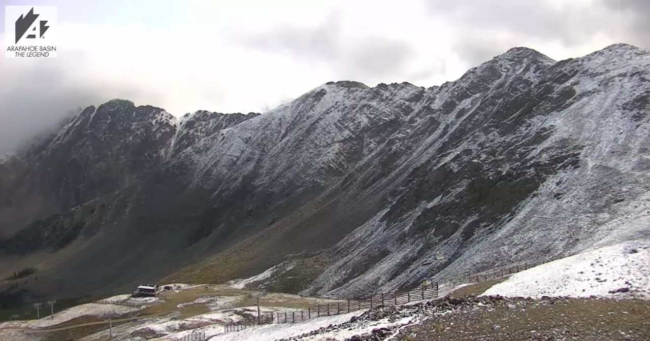 Colorado’s first snow of the season leaves dusting of white powder atop several peaks