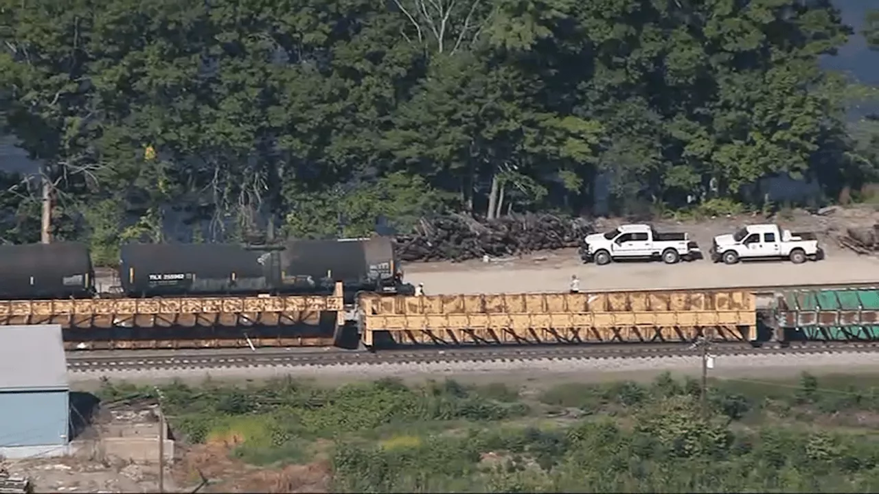 Emergency crews at the scene of freight train derailment in Ayer