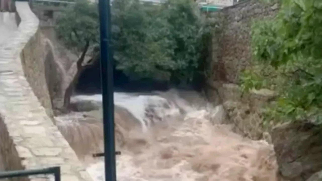 Horror moment terrifying flood surges through Majorca mountain resort as Brit hiker, 26, killed & her...