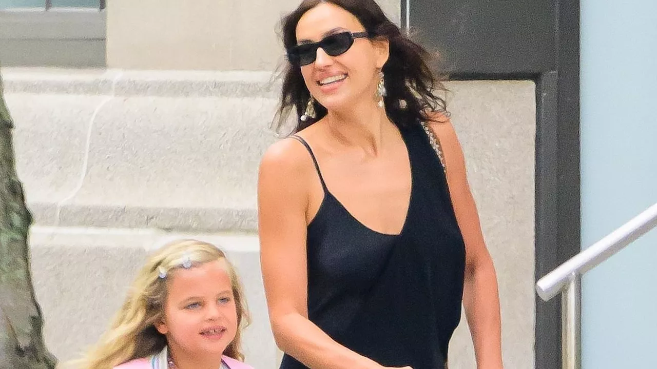 Irina Shayk beams alongside her daughter Lea, seven, in NYC as her ex Bradley Cooper is seen on a...