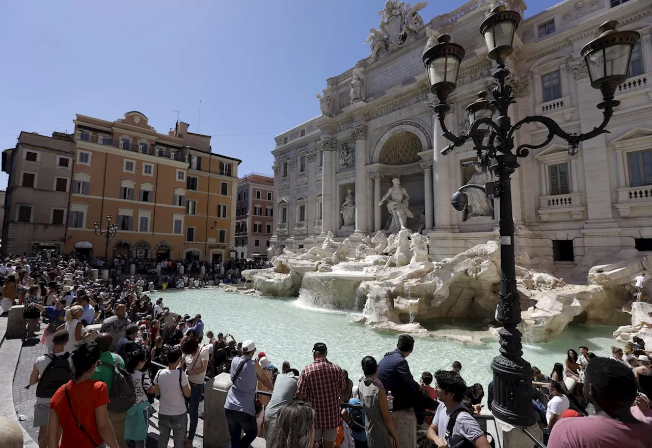 Rome considers imposing a fee to discourage crowds and plunges at Trevi Fountain