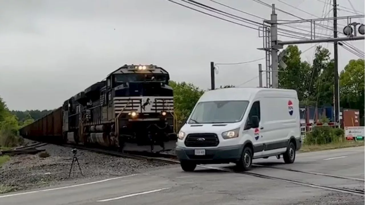 VIDEO: Train misses Pepsi van by inches at railroad crossing