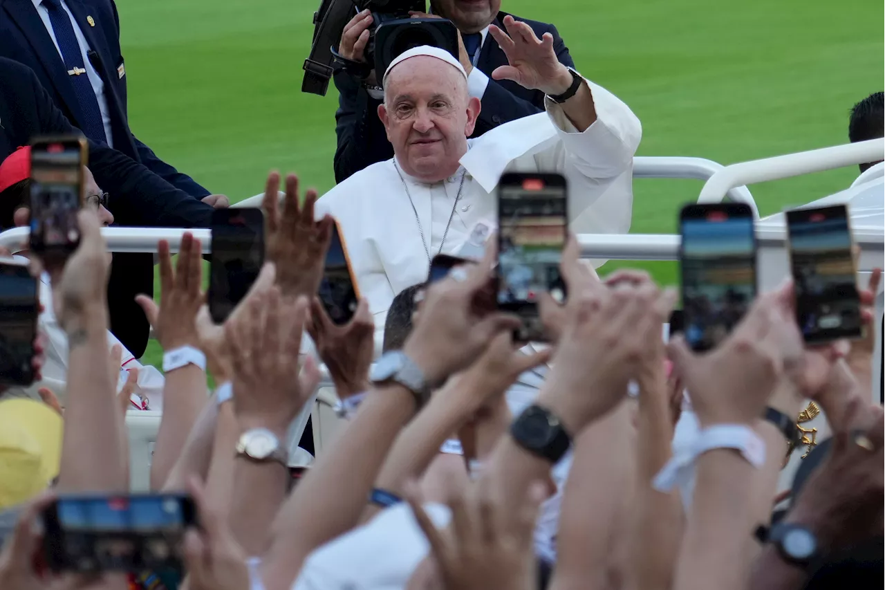 Pope heads to Papua New Guinea after final Mass in Indonesia before an overflow crowd of 100,000