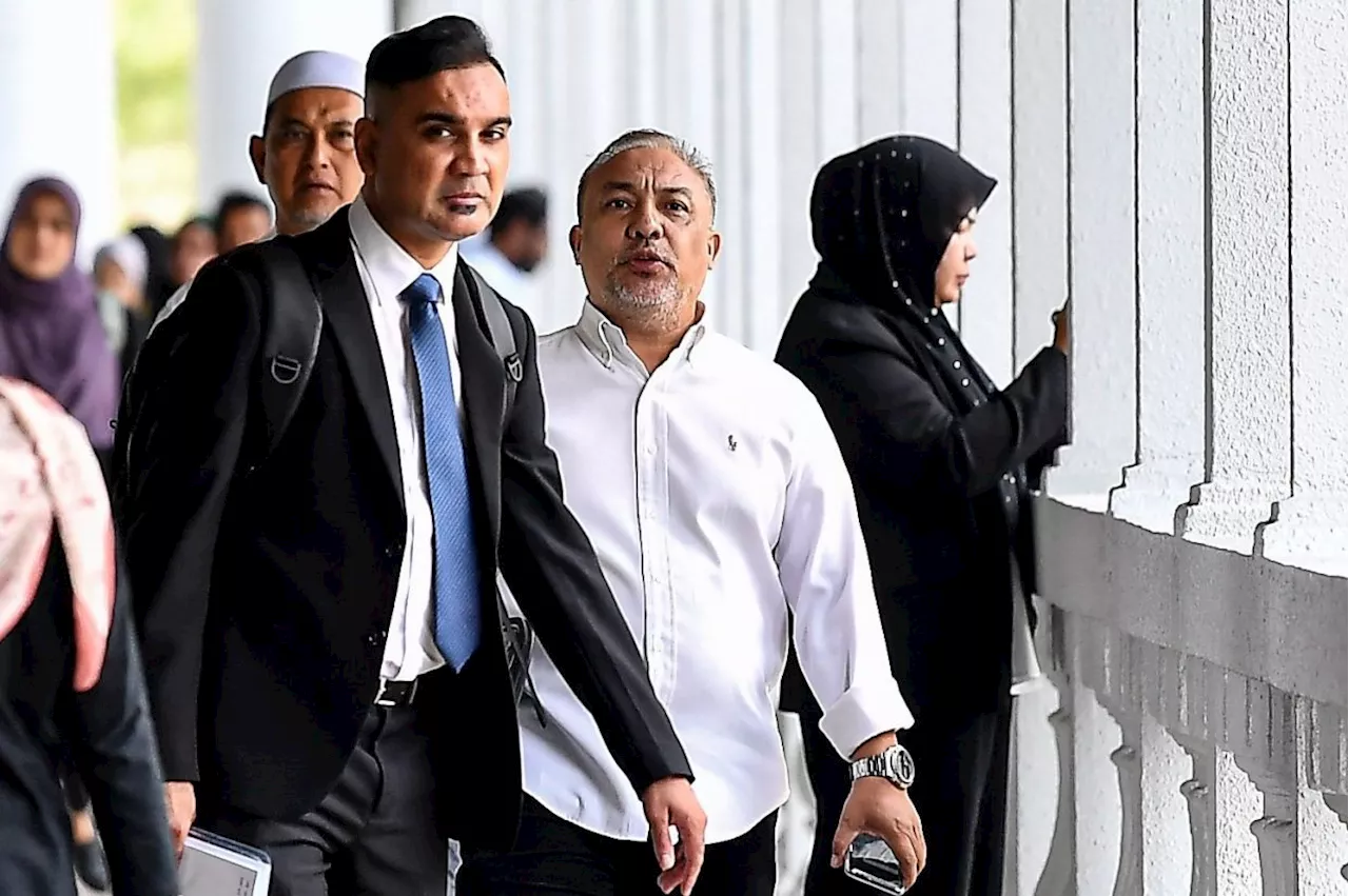 Datuk claims trial in KL to five charges of cheating, using fake documents