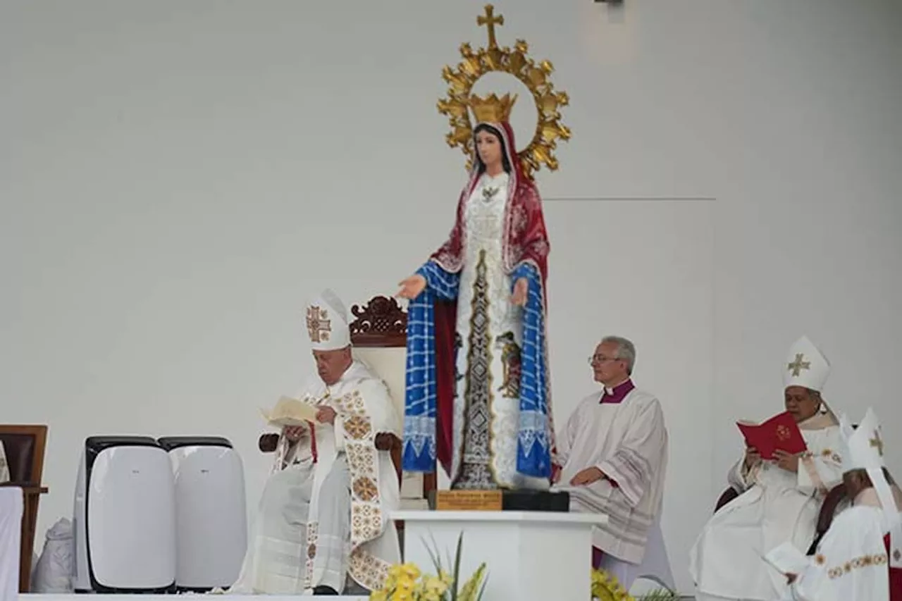 Pope heads to Papua New Guinea after final mass in Indonesia before an overflow crowd of 100,000