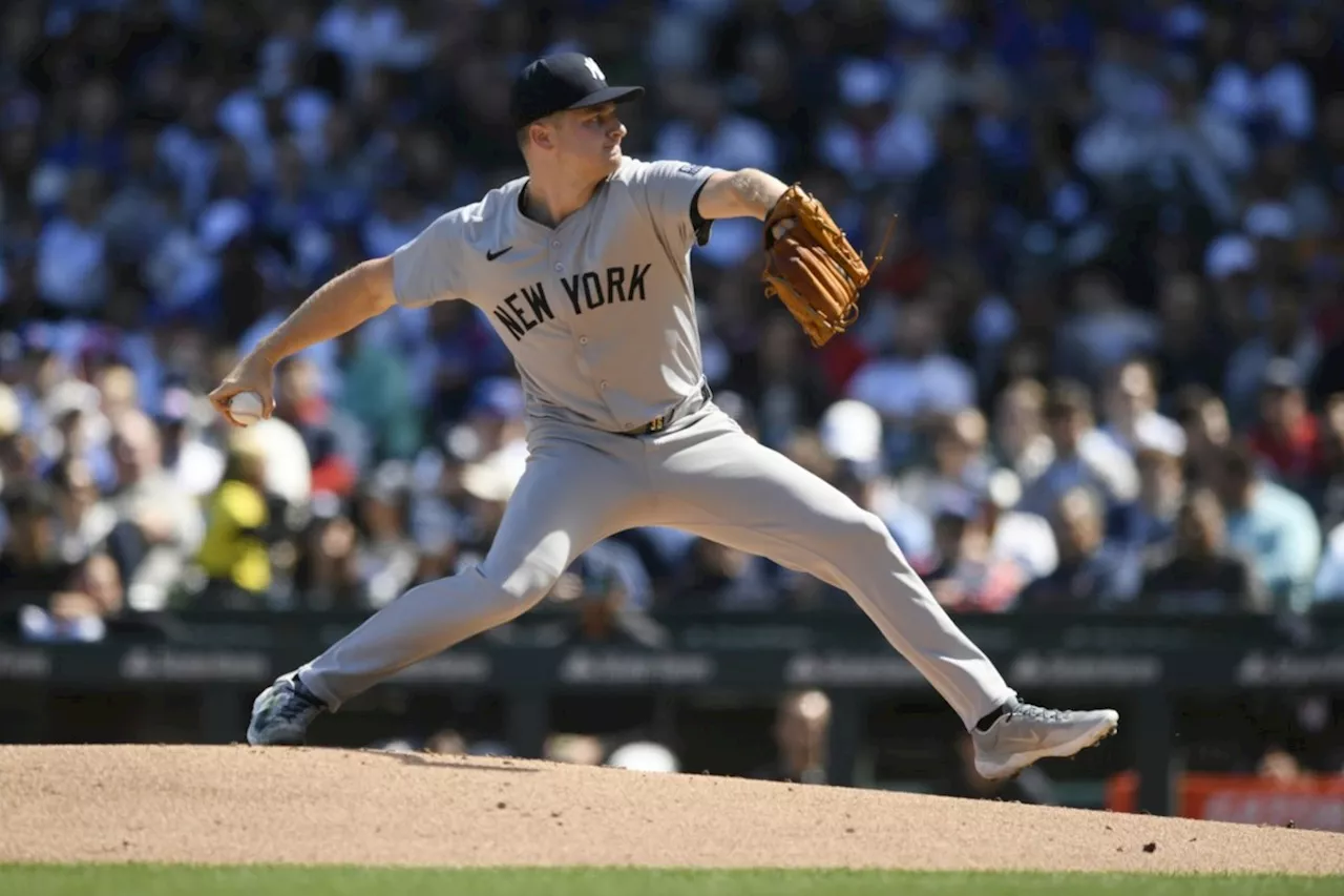 Schmidt and Cortes combine for a 4-hitter as the Yankees blank the Cubs once again