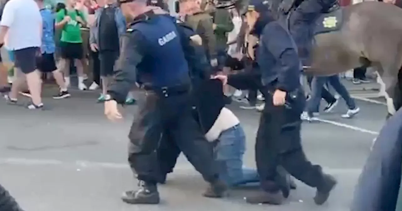 Man dragged through streets by gardai as Ireland and England fans clash