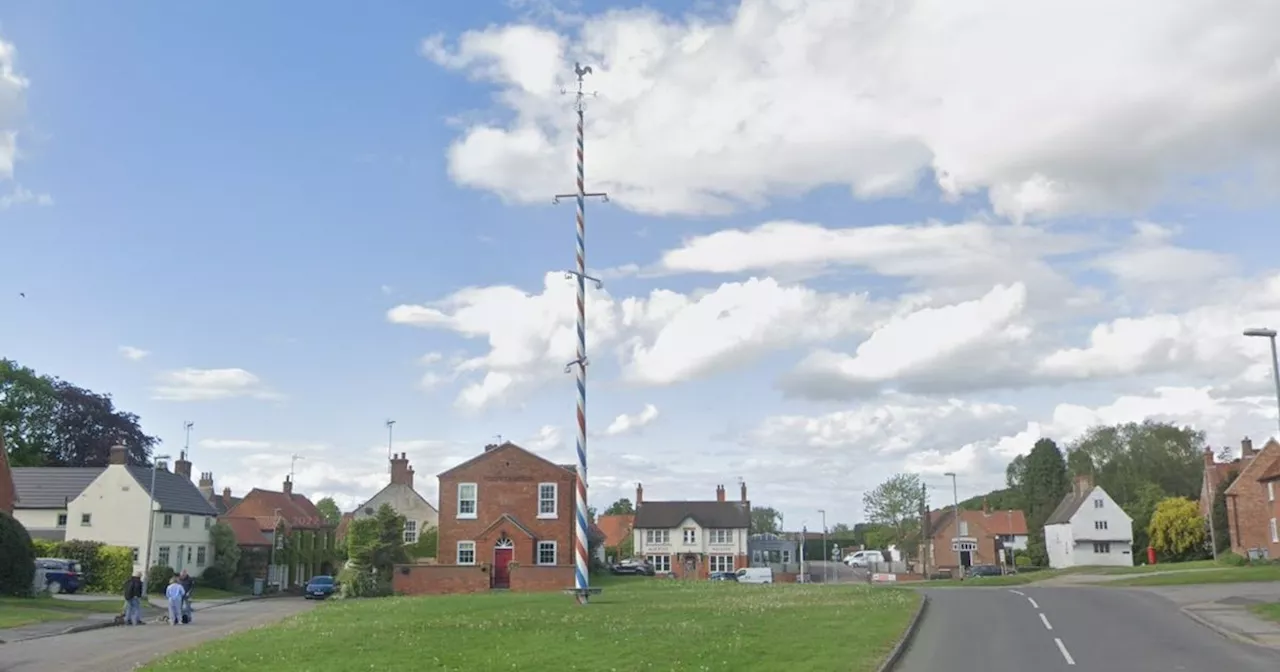 Quaint village next to ancient woodland that is home to the Notts' only Maypole