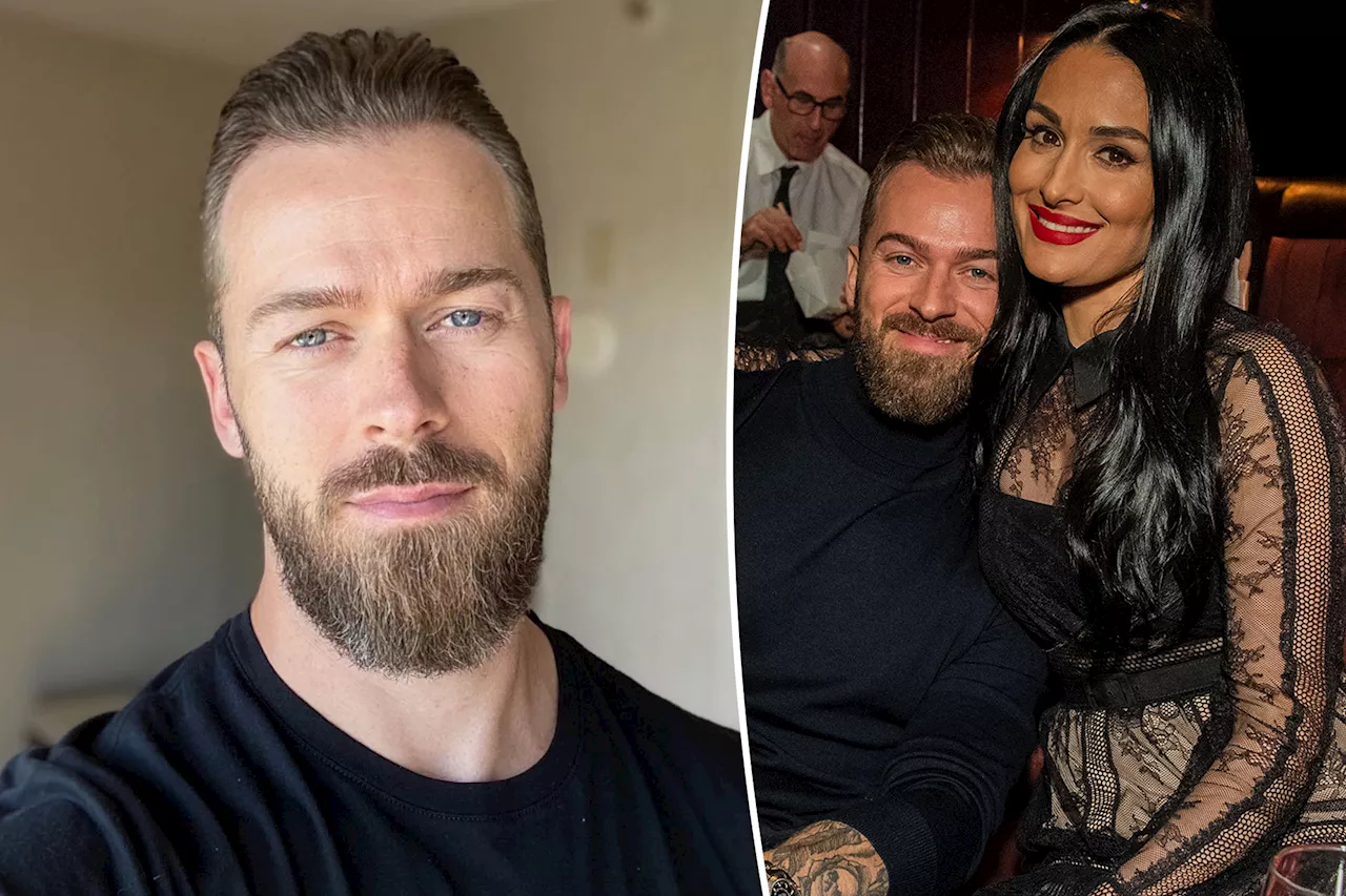 Artem Chigvintsev removes wife Nikki Garcia's name from his Instagram bio after domestic violence arrest