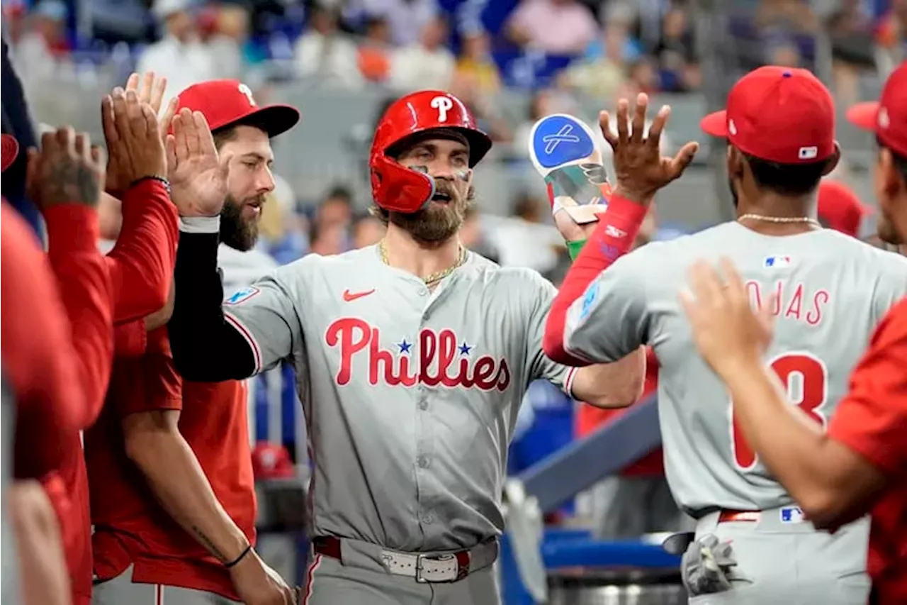 Phillies maul Marlins with 22-hit barrage but lose J.T. Realmuto to bruised left knee