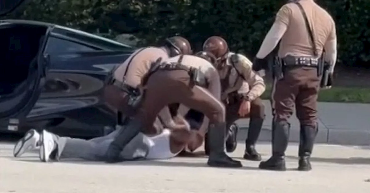 Police swarm NFL star on the road in dramatic vision