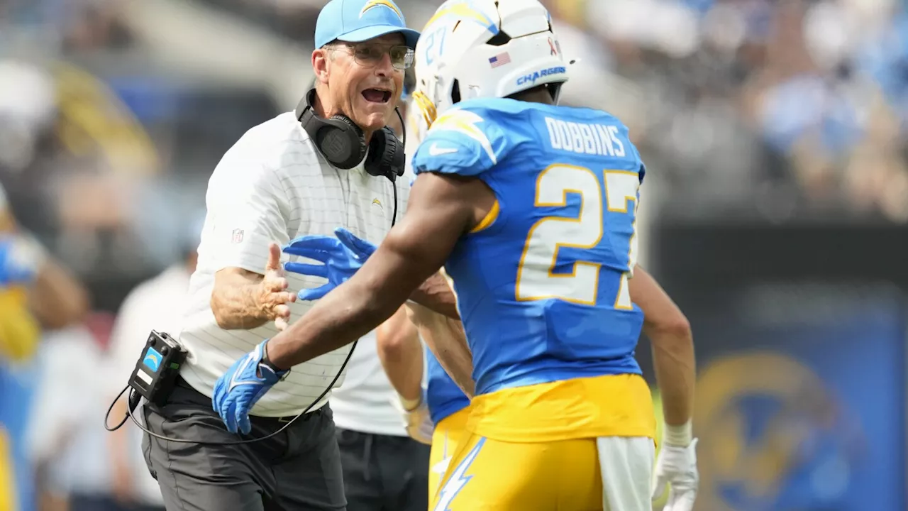 J.K. Dobbins rushes for 135 yards as the Chargers beat the Raiders 22-10 in Jim Harbaugh's debut