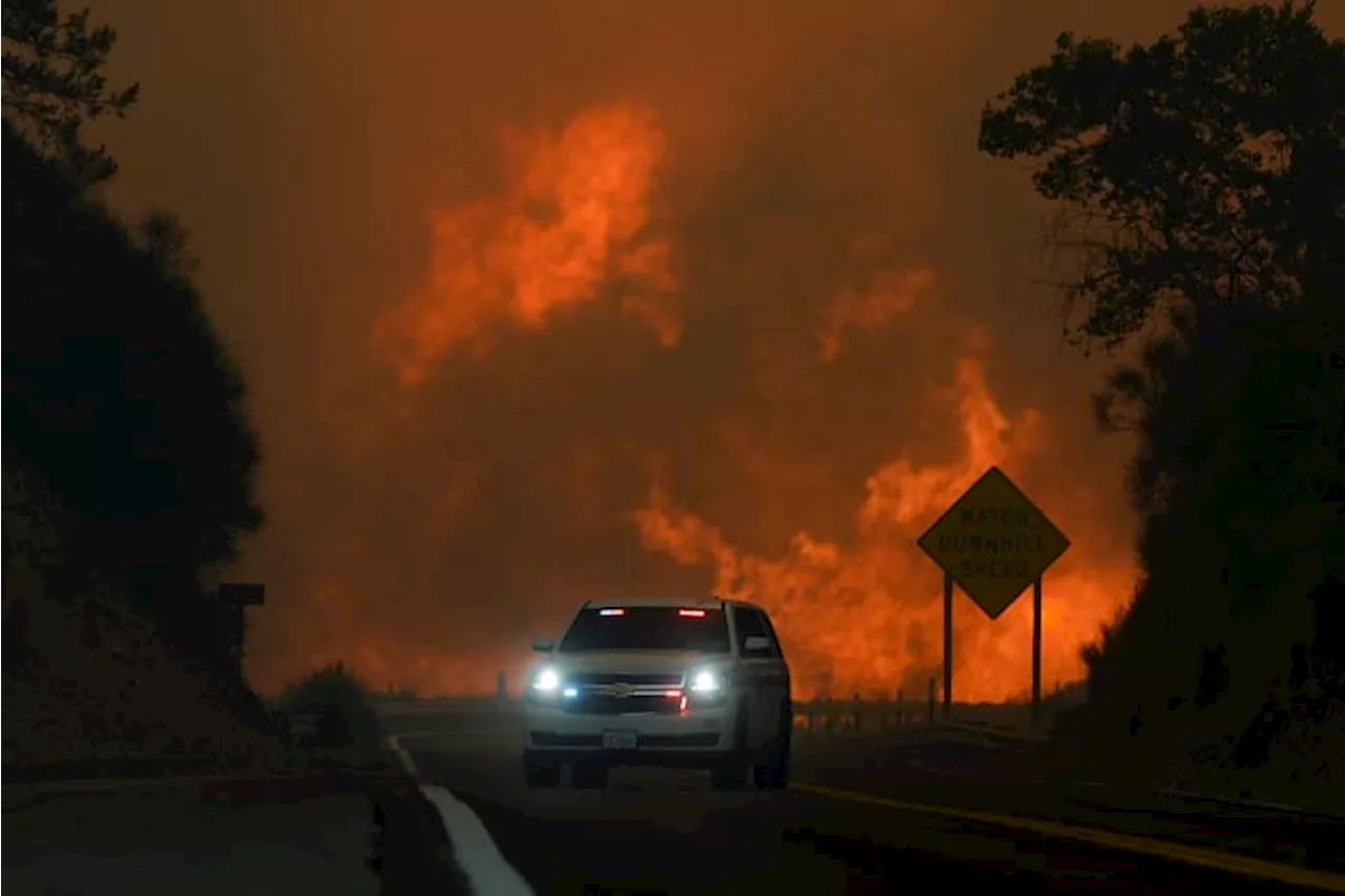 Wildfire east of LA threatens thousands of homes and forces evacuations