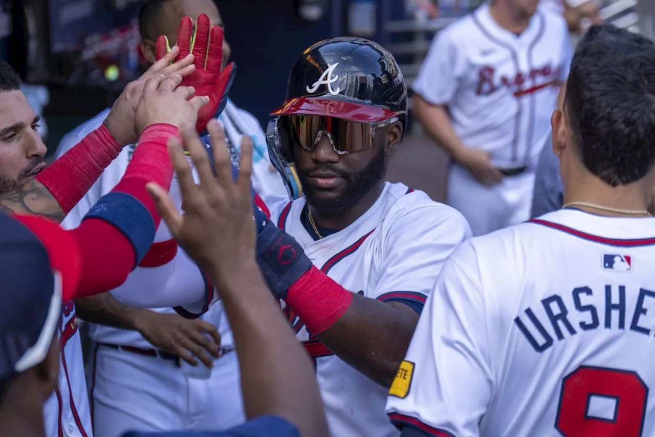 Braves rally to beat Blue Jays 4-3 in the 11th, move into a tie with Mets for final NL wild card